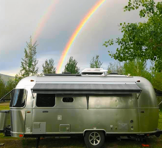 Follow Your Dream - Follow A Rainbow - Airstream and double rainbow outside Yellowstone