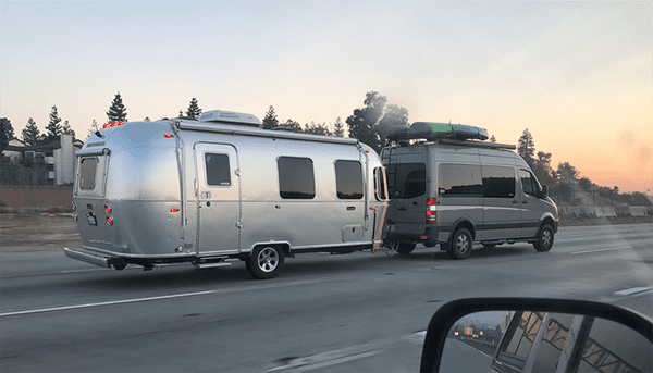 Follow Your Dream: An RV Living for Beginners Guide - A Sprinter Van towing an Airstream Travel Trailer 